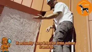 Austin Braden, owner of On Point Roofing, demonstrates the leak path found during a Denton TX water-test inspection — proof that even small flashing failures can send water deep into framing.